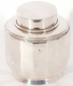 Silver hallmarked panelled caddy of squat baluster form, pull off lid with applied garland edge,