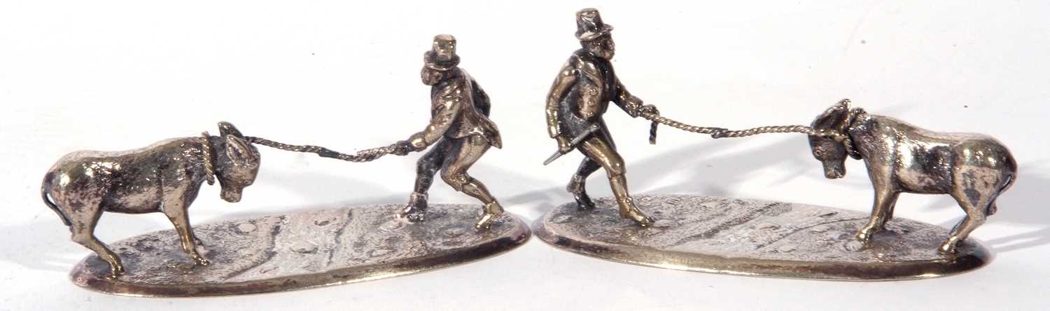 Pair of early 20th century electro-silver plate table ornaments formed as figures pulling a - Image 2 of 5
