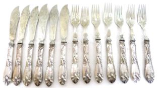 Mixed Lot: twelve Continental fish eaters, the ornate floral decorated handles stamped '800', (seven