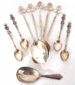 Cased set of six Elizabeth II fruit spoons in Art Deco taste with stylised handles and egg shaped