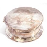 George V silver powder box of circular form, the geometric engraved hinged lid opening to a gilt