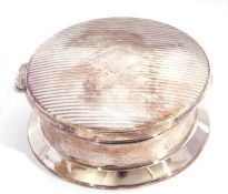 George V silver powder box of circular form, the geometric engraved hinged lid opening to a gilt