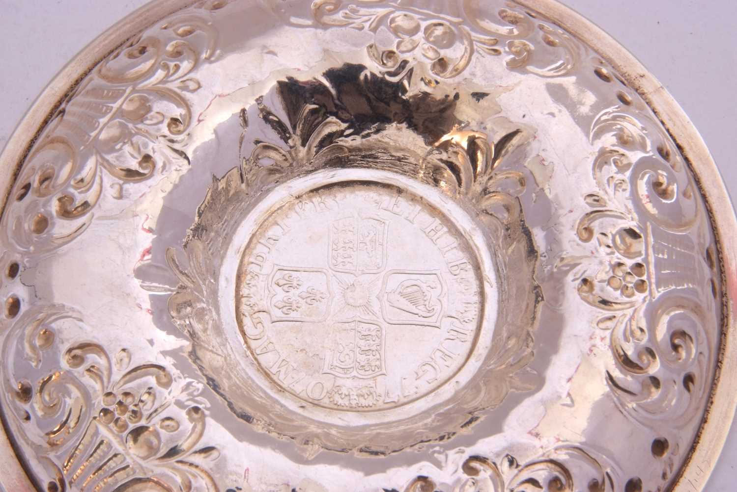 White metal dish of circular form, embossed with baskets of flowers, the centre raised with a 1707 - Image 5 of 5