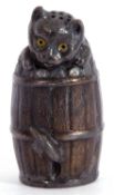 Vintage metal novelty cat pepper, naturalistically modelled with a cat stuck in a barrel, 8cm high