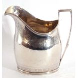 George III silver cream jug of helmet shape, features a reeded top rim, angular handle, the body