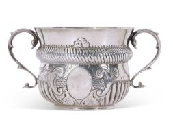 Edwardian silver two-handled poringer in 17th century style of circular baluster form with reeded