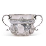 Edwardian silver two-handled poringer in 17th century style of circular baluster form with reeded