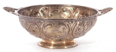 Victorian silver twin handled bowl of squat round form with pierced shell handles, elaborately