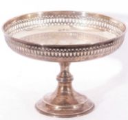 George V silver pedestal tazza of circular form with pierced border, knopped stem to a spreading