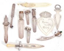 Mixed Lot: eight hallmarked silver page markers to include Victorian heart shaped Christmas