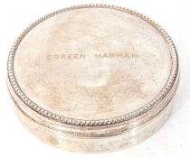 Portuguese white metal circular lidded box, the push on lid with beaded border, engraved to centre