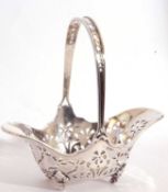 Edwardian silver bon-bon basket, the geometric pierced design body with an applied pierced and