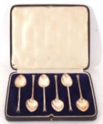 Cased set of six George V tea spoons with cast terminals and rat-tail bowls, Sheffield 1935,