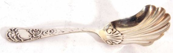 Victorian silver shovel caddy spoon, the long handle decorated with a scroll border and vacant