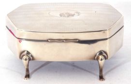 George V silver trinket/ring box of shaped rectangular form, engine turned decoration around a