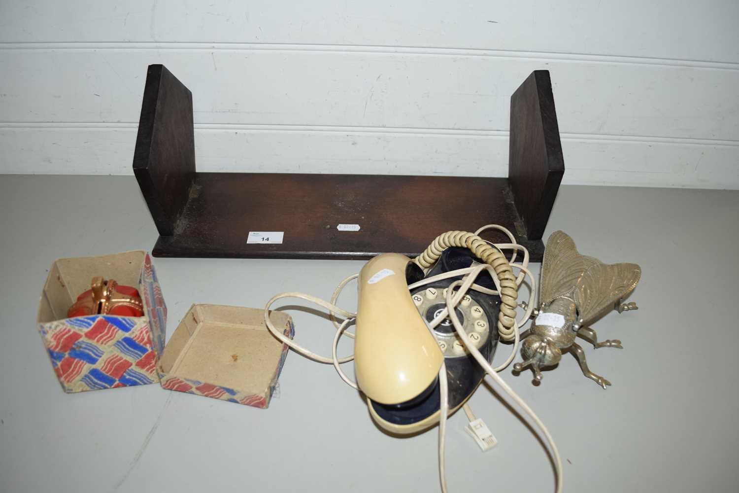 MIXED LOT COMPRISING A HARDWOOD BOOK RACK, A CROWN FORMED MONEY BOX, VINTAGE TELEPHONE AND A FLY