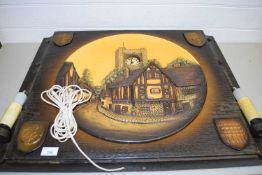 UNUSUAL WALL PLAQUE PICTURE CLOCK, THE CENTRE FORMED AS A PLATE DECORATED WITH TUDOR COTTAGES FITTED