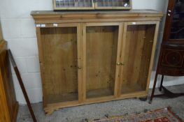 20TH CENTURY PINE GLAZED THREE DOOR BOOKCASE CABINET