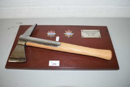 LONDON FIRE BRIGADE PRESENTATION AXE AWARDED TO KEN PRISS, 1979-2010, MOUNTED ON A WOODEN BACKING