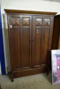 EARLY 20TH CENTURY OAK WARDROBE WITH TWO PANELLED DOORS OVER A SINGLE DRAWER BASE, 191CM HIGH