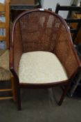20TH CENTURY HARDWOOD FRAMED AND CANE TUB CHAIR