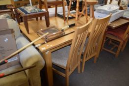 MODERN OAK EXTENDING DINING TABLE AND FOUR CHAIRS