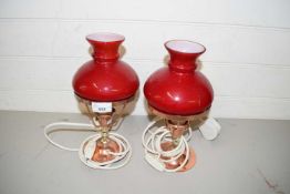 PAIR OF COPPER FRAMED TABLE LAMPS WITH RED GLASS SHADES