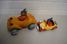 TWO NODDY FIGURES IN CARS, ONE CONSTRUCTED OF FOAM