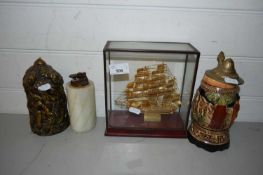 MIXED LOT: A METAL MODEL OF A TALL SHIP SET IN GLASS CASE, A BEER STEIN, TABLE LIGHTER AND A NOVELTY