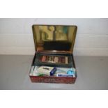 TIN CONTAINING KNIVES, GLASS STEM VASES, PLAYING CARDS ETC