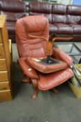 RED LEATHER REVOLVING CHAIR AND ACCOMPANYING FOOT STOOL