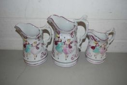 GRADUATED SET OF THREE VICTORIAN PINK LUSTRE FINISH JUGS DECORATED WITH DANCING FIGURES