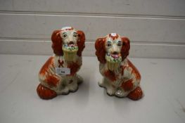 PAIR OF 20TH CENTURY STAFFORDSHIRE DOGS WITH FLORAL BASKET