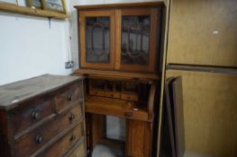 EARLY 20TH CENTURY HARDWOOD BUREAU BOOKCASE WITH GLAZED TOP SECTION AND CYLINDER FRONT OVER TWIN