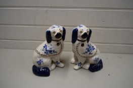 PAIR OF 20TH CENTURY STAFFORDSHIRE DOGS WITH BLUE FLORAL DECORATION