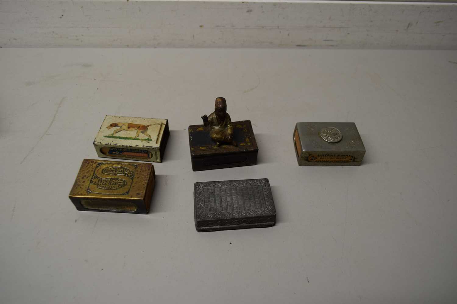 COLLECTION OF VARIOUS BASE METAL MATCHBOX COVERS TO INCLUDE ONE MOUNTED WITH A SEATED FIGURE OF A