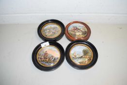 FOUR VARIOUS PRATT WARE POT LIDS IN CIRCULAR WOODEN FRAMES