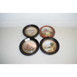 FOUR VARIOUS PRATT WARE POT LIDS IN CIRCULAR WOODEN FRAMES