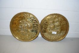 TWO BRASS WALL PLAQUES DECORATED WITH SHIPS