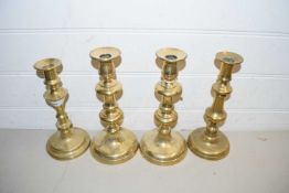 FOUR BRASS CANDLESTICKS