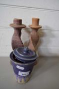 PAIR OF TURNED STONE CANDLESTICKS AND A JAR OF CURTAIN RINGS