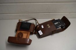TWO CAMERAS IN LEATHER CASES