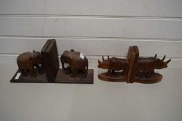 PAIR OF ELEPHANT BOOKENDDS TOGETHER WITH A PAIR OF RHINOCEROS WOODEN BOOKENDS