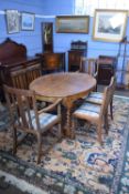 Early 20th century oval oak dining table raised on barley twist legs with X-formed stretcher,