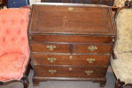 18th century oak bureau, the fall front opening to an interior fitted with small drawers,