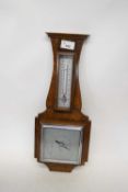 Early 20th century oak cased aneroid barometer and thermometer combination