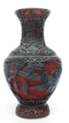 Oriental vase, the cinnabar type ground with carved wooden decoration, 17cm high