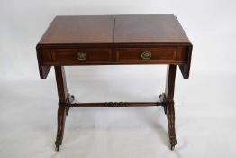 Victorian mahogany sofa table with frieze drawers, drop leaves, raised on turned supports with swept