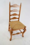 Set of eight reproduction oak ladderback and rush seated dining chairs with cabriole legs and turned