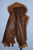 WWII sheepskin flying jacket together with a pair of brown gauntlet gloves